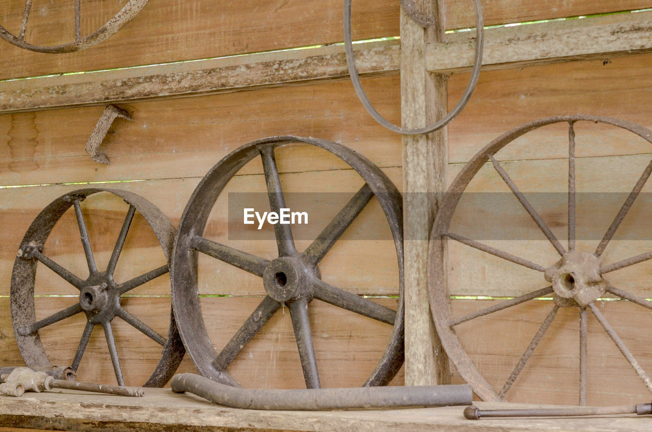 Wheels mounted on wooden wall