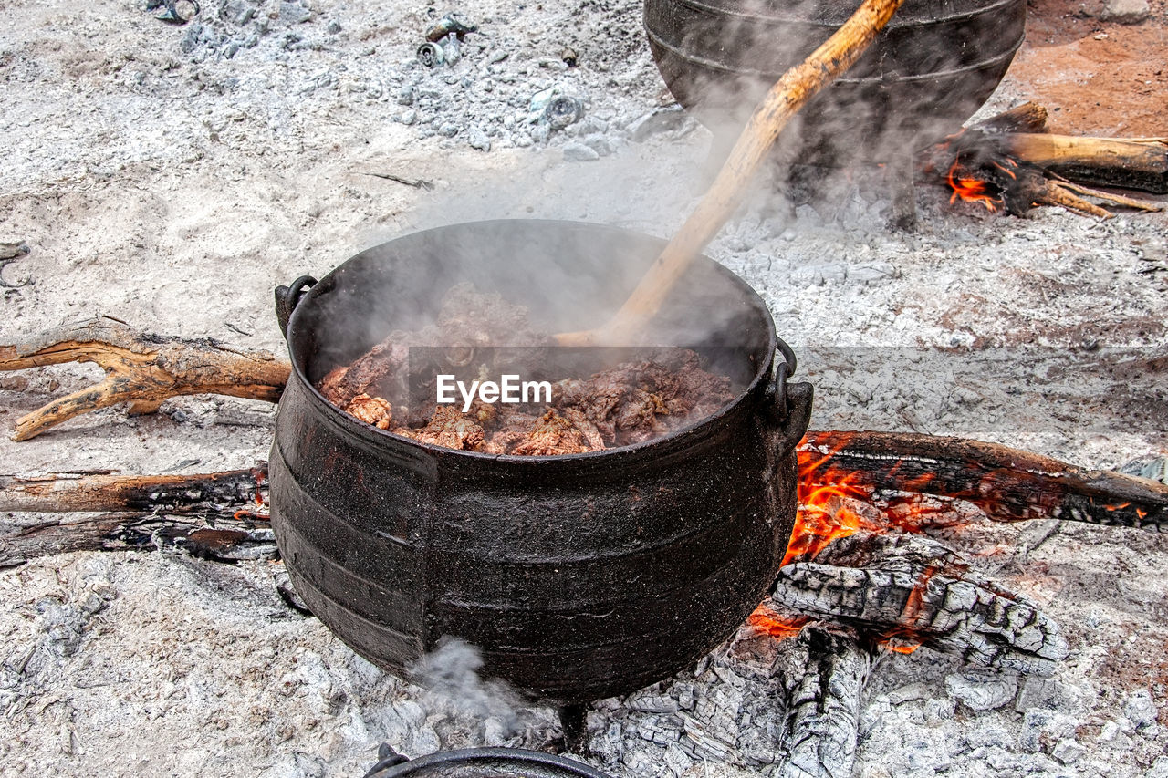 HIGH ANGLE VIEW OF BONFIRE ON BARBECUE