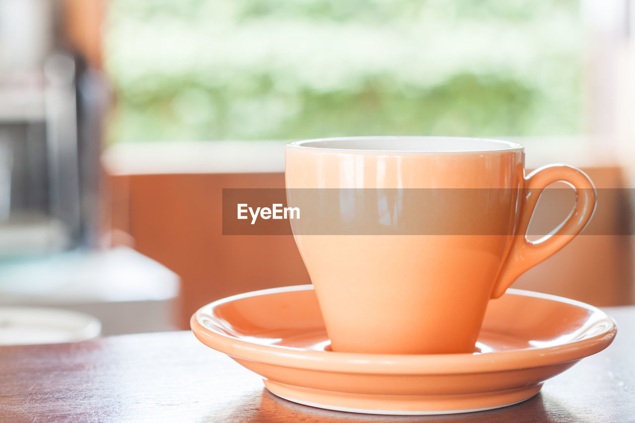 Close-up of coffee cup on table