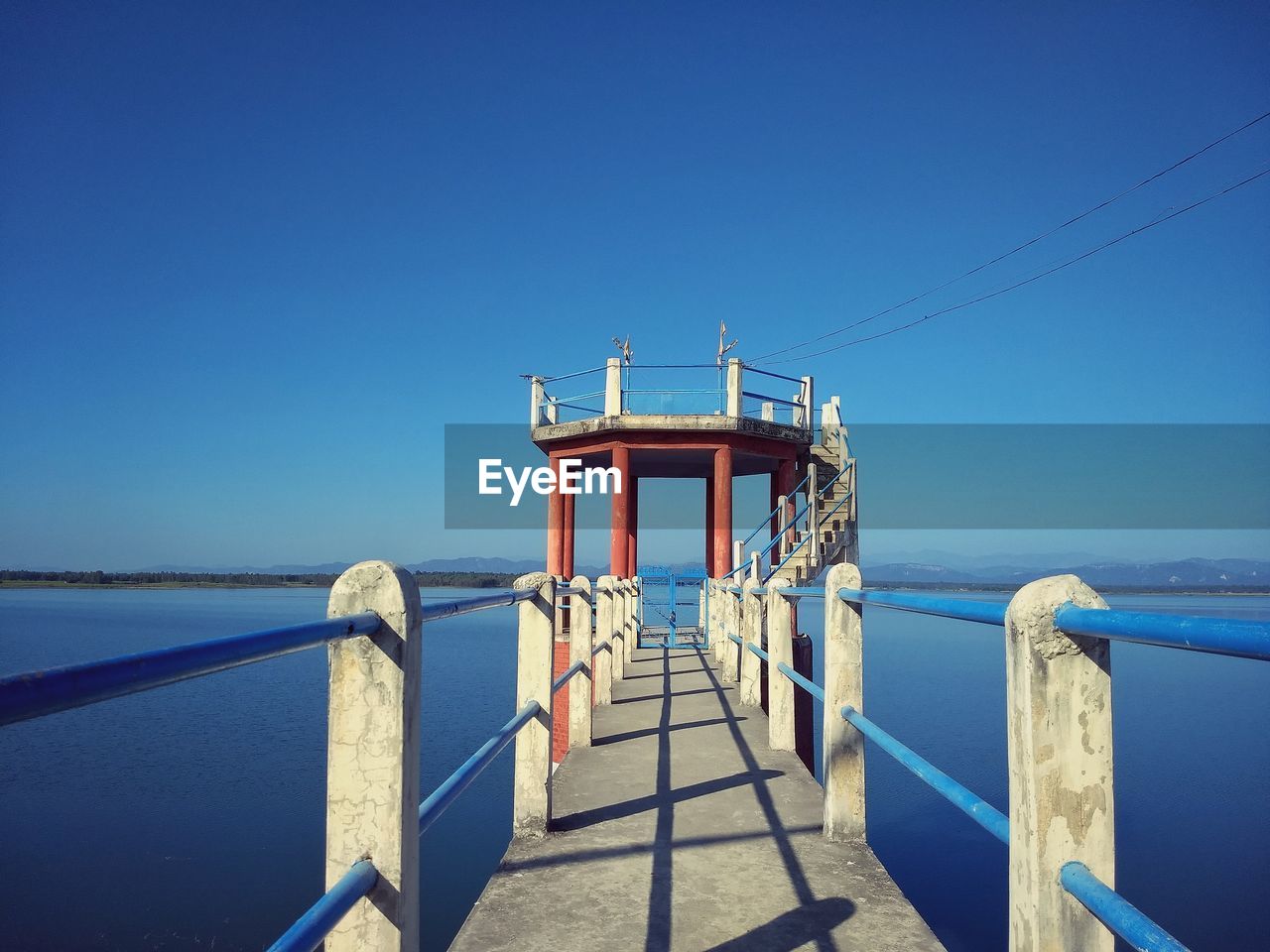 LIFEGUARD HUT BY SEA AGAINST CLEAR SKY