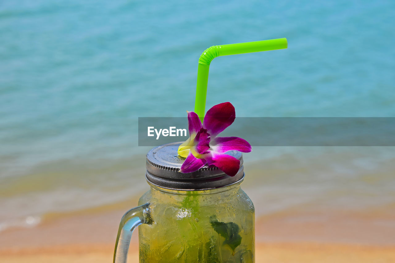 Flower on cocktail at beach