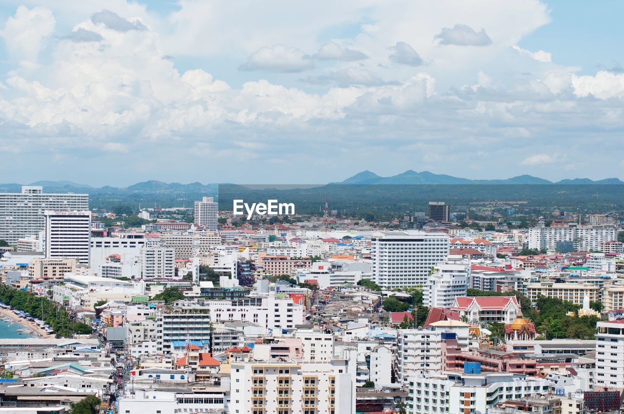 HIGH ANGLE VIEW OF BUILDINGS AGAINST SKY