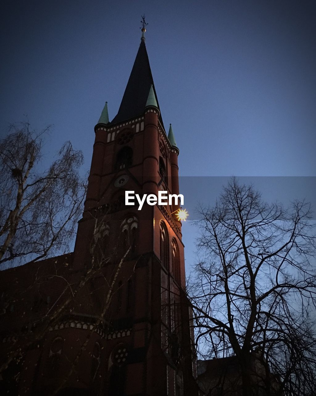 Low angle view of clock tower against sky