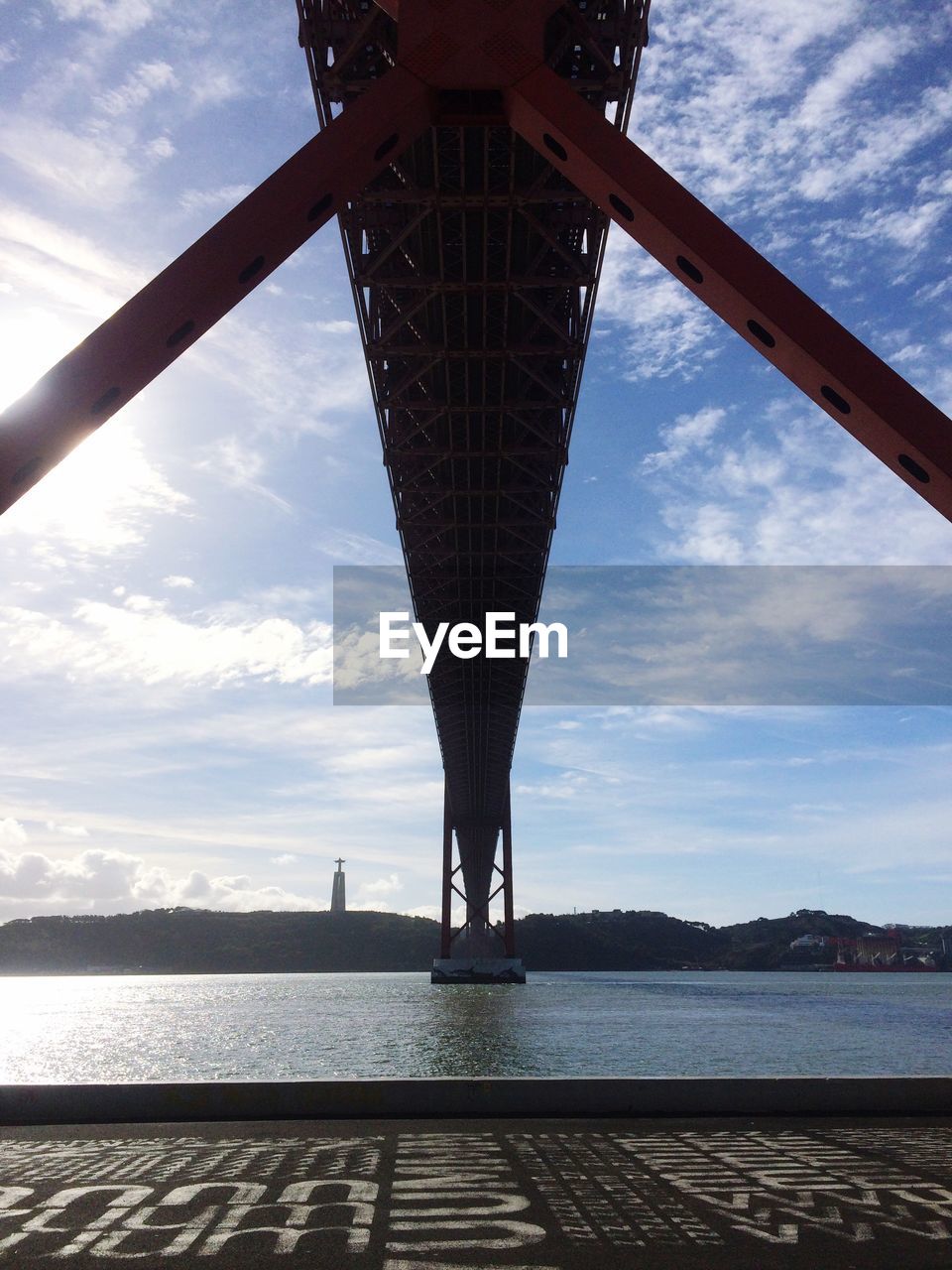 LOW ANGLE VIEW OF BRIDGE AGAINST SKY AT SUNSET