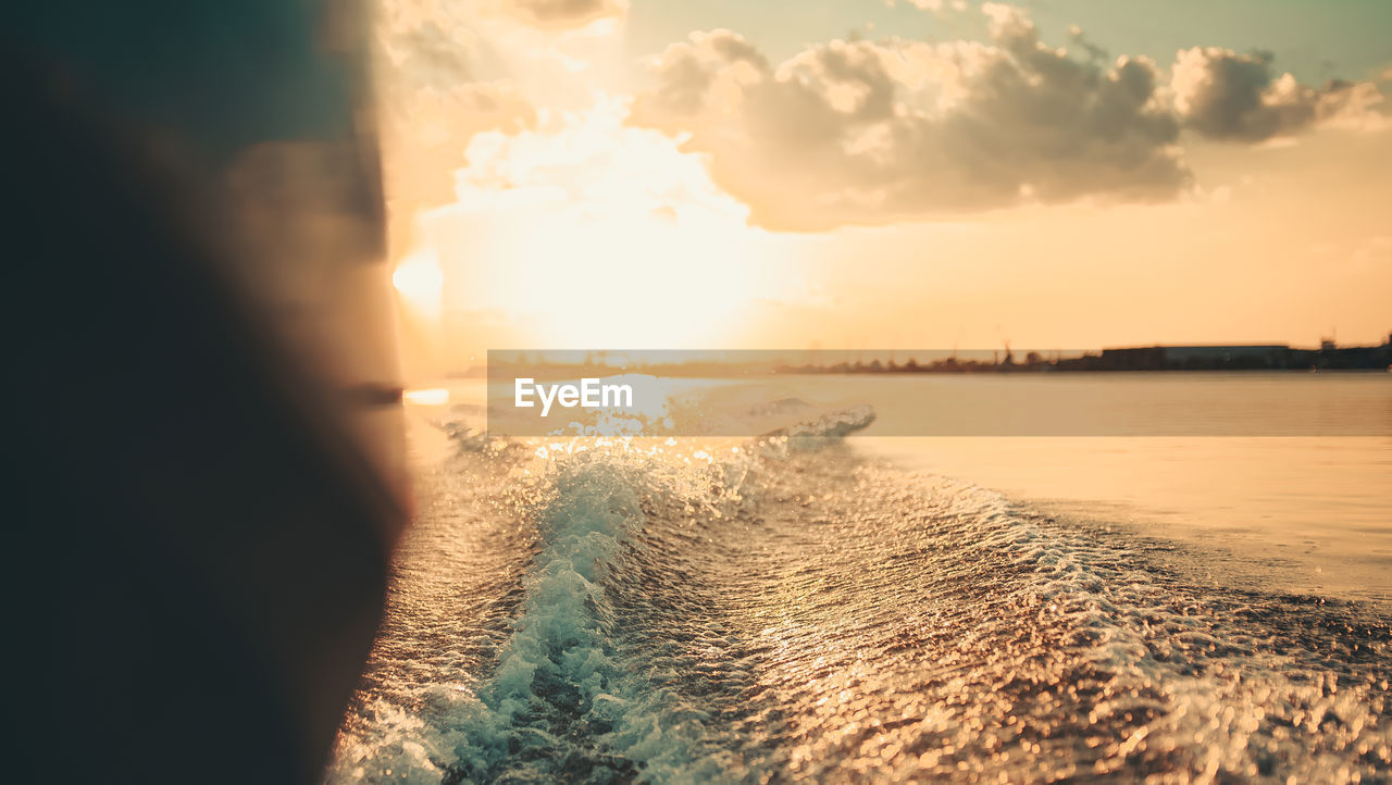 PANORAMIC SHOT OF SEA AGAINST SKY DURING SUNSET