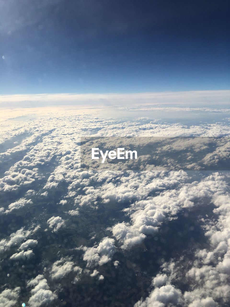 Aerial view of cloudscape over ocean against sky