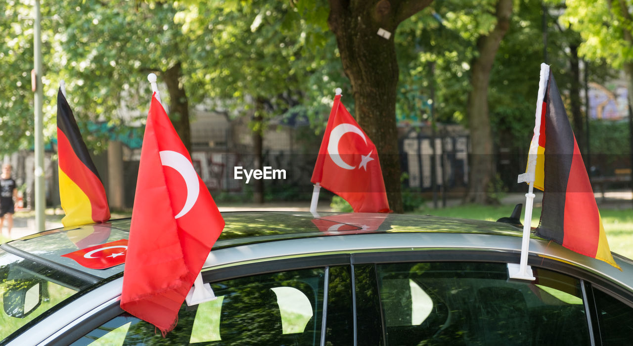 Turkish and german flags on car