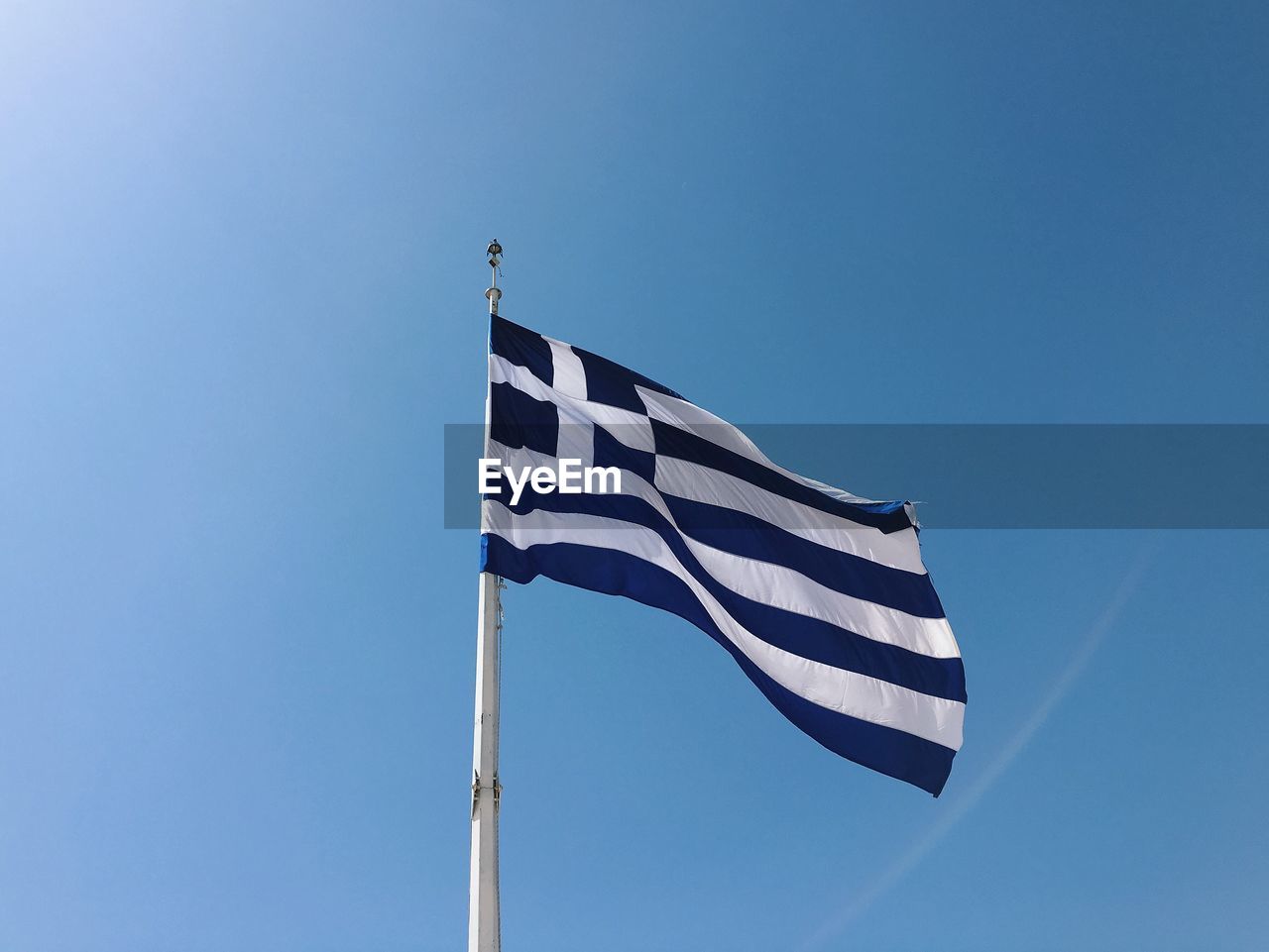 Greek flag against clear sky