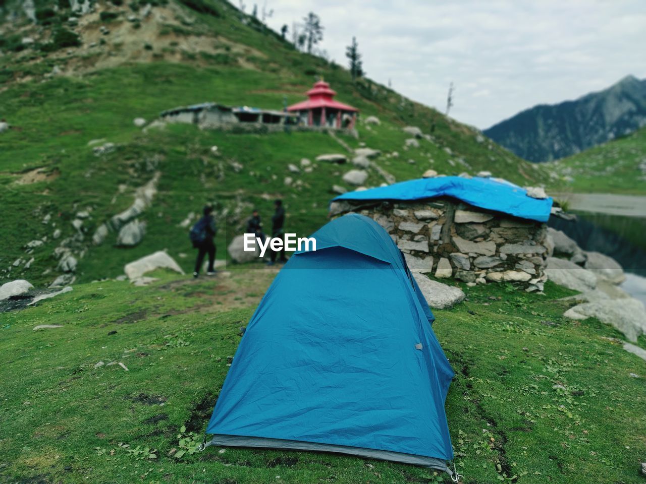 Scenic view of tent on land against mountains