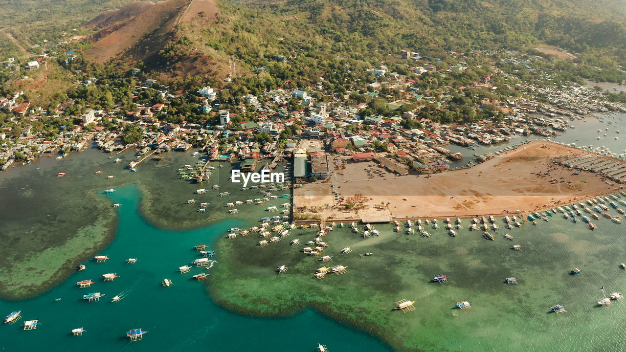 Coron town with boats on busuanga island, philippines, palawan. coron city with slums 