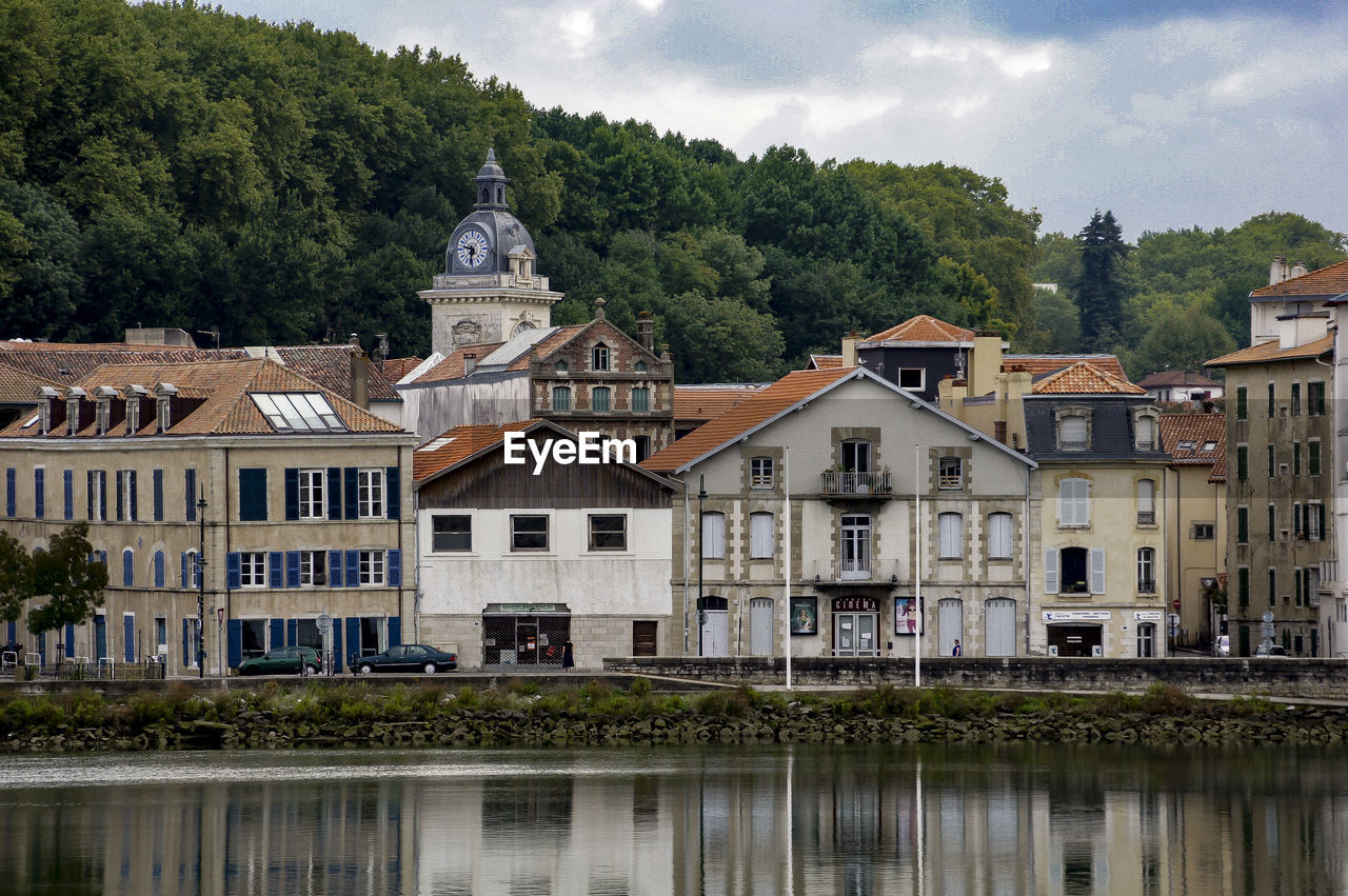 Buildings by river nive at saint-jean-pied-de-port