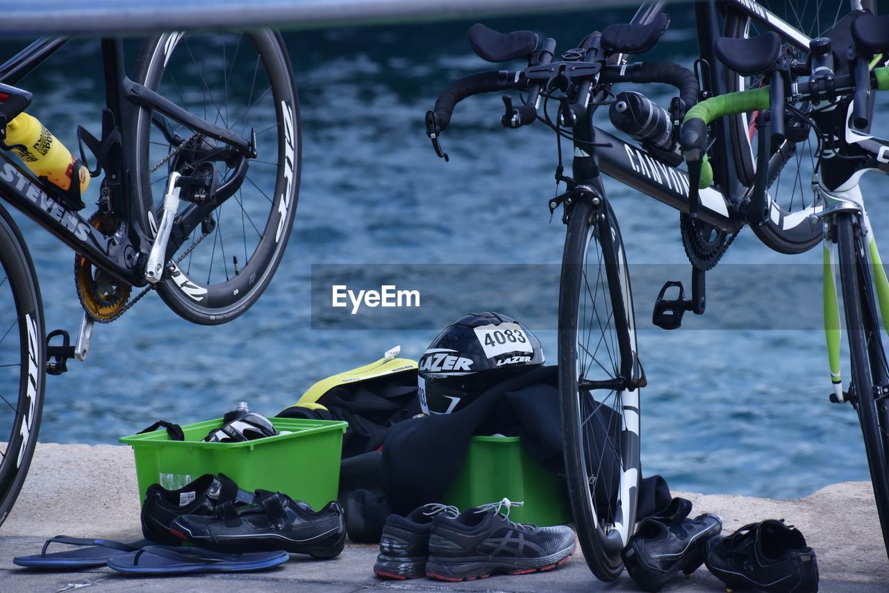 CLOSE-UP OF BICYCLE PARKED IN SEA