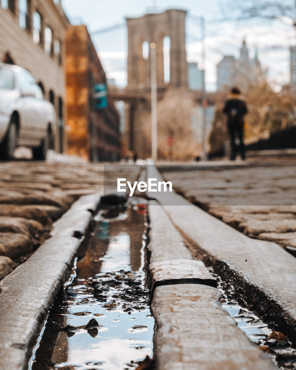 PUDDLE ON ROAD DURING WINTER