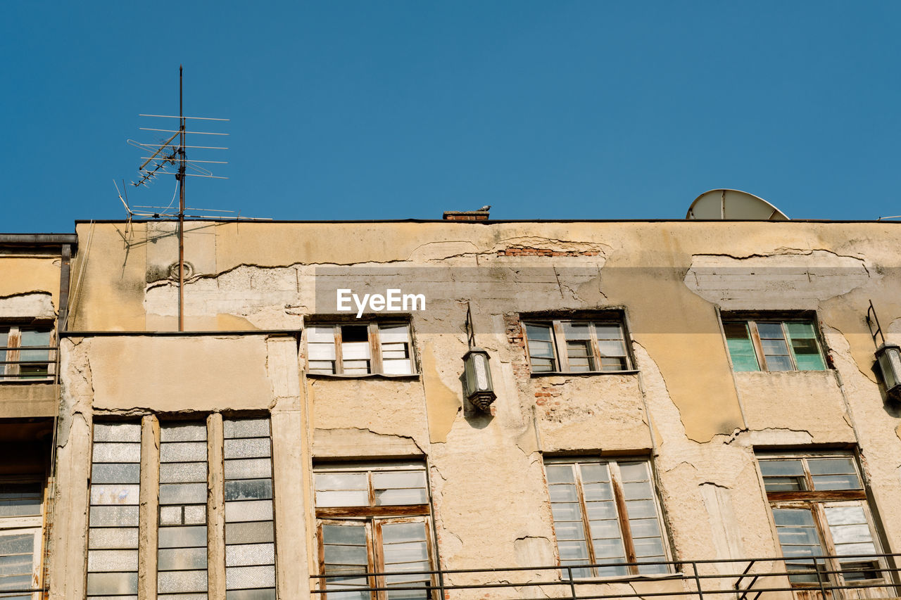 Low angle view of building against clear blue sky