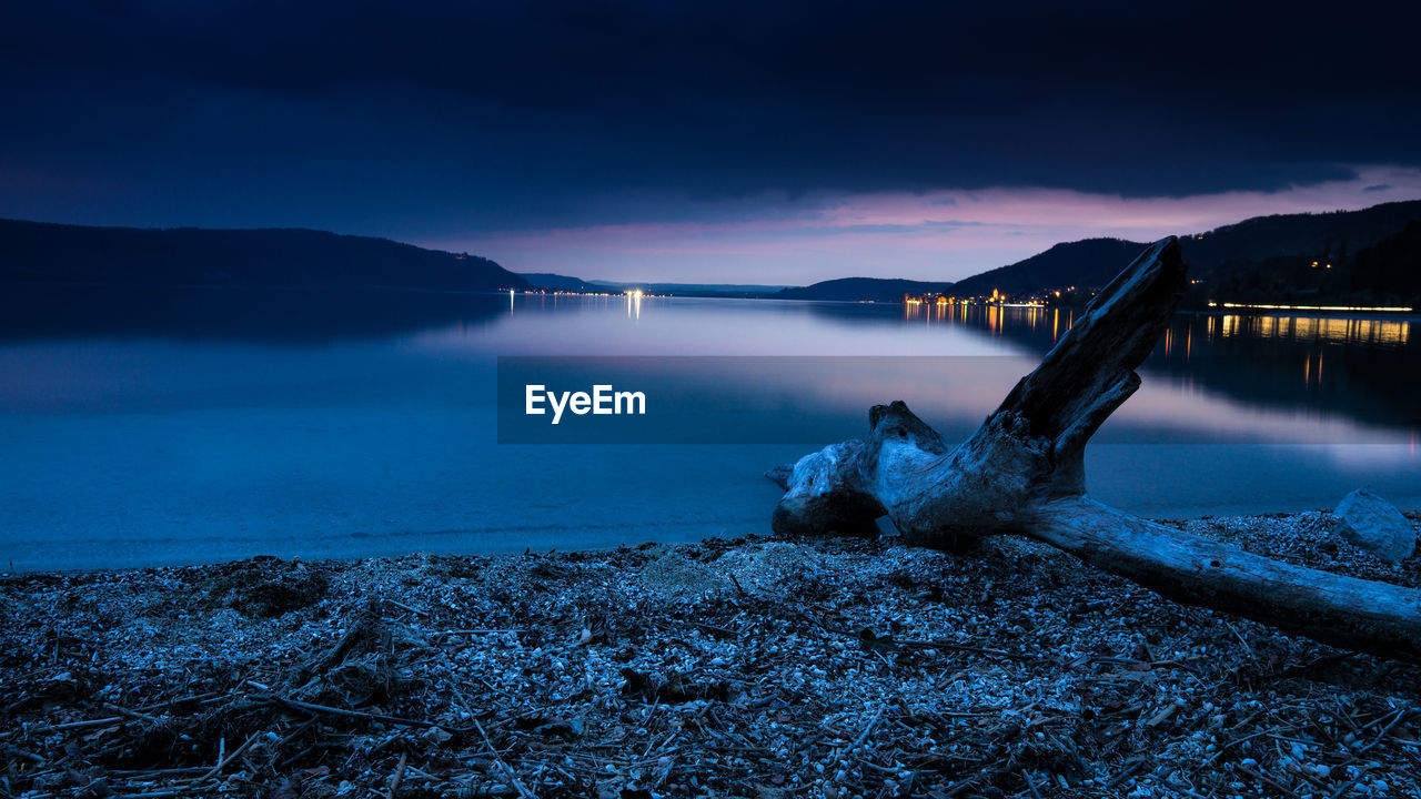 Scenic view of sea against sky at night