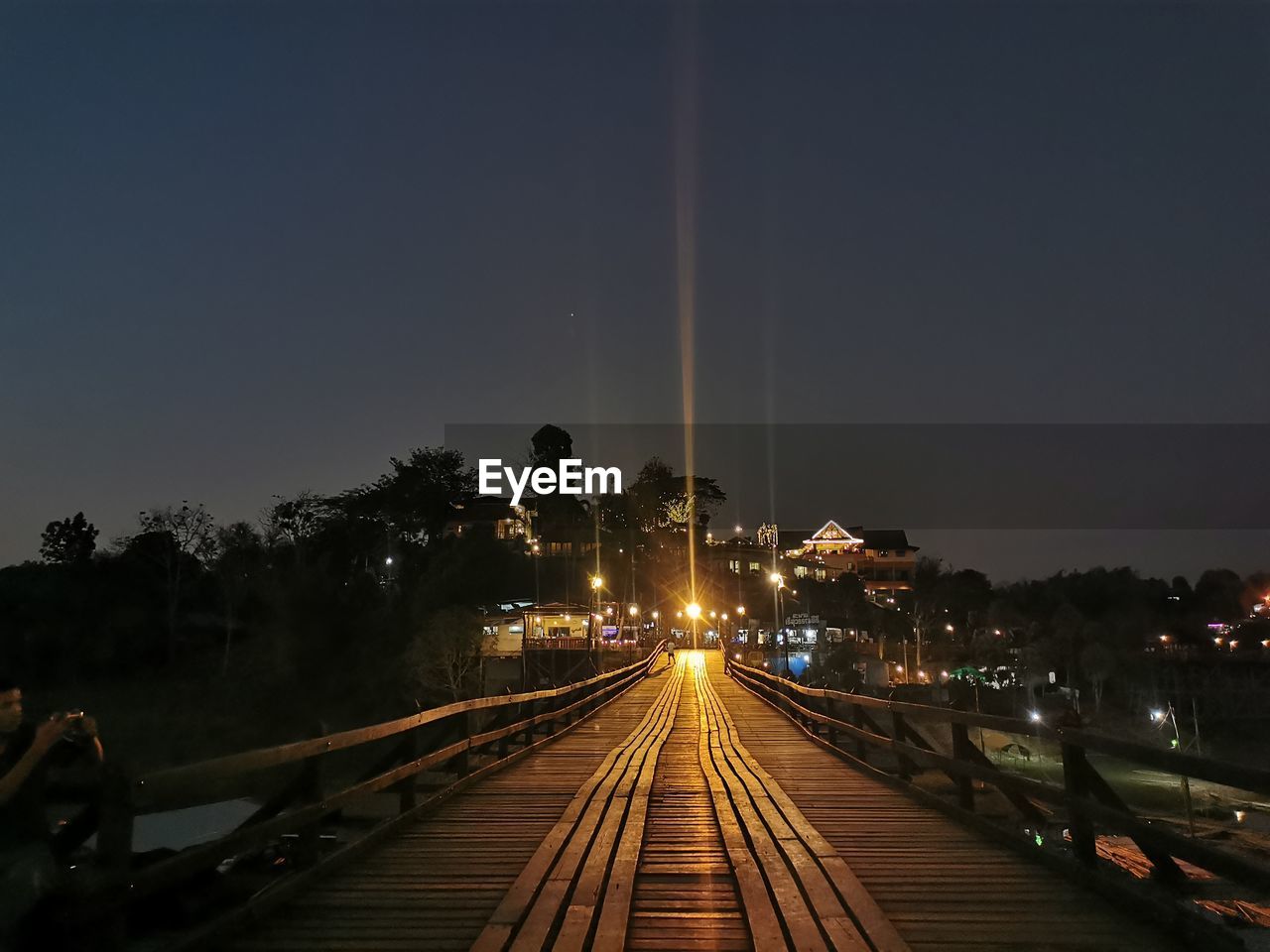 RAILROAD TRACKS AGAINST SKY DURING SUNSET