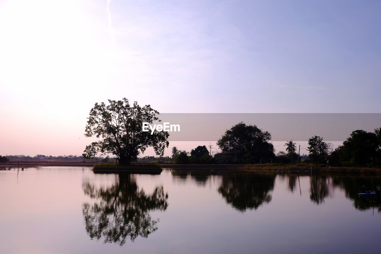 Scenic view of lake against sky during sunset