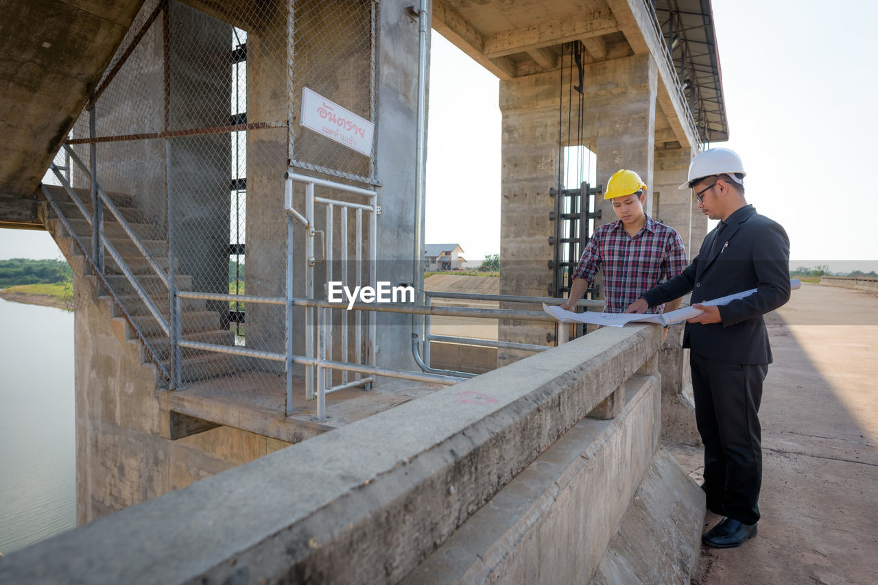 Engineers working at construction site