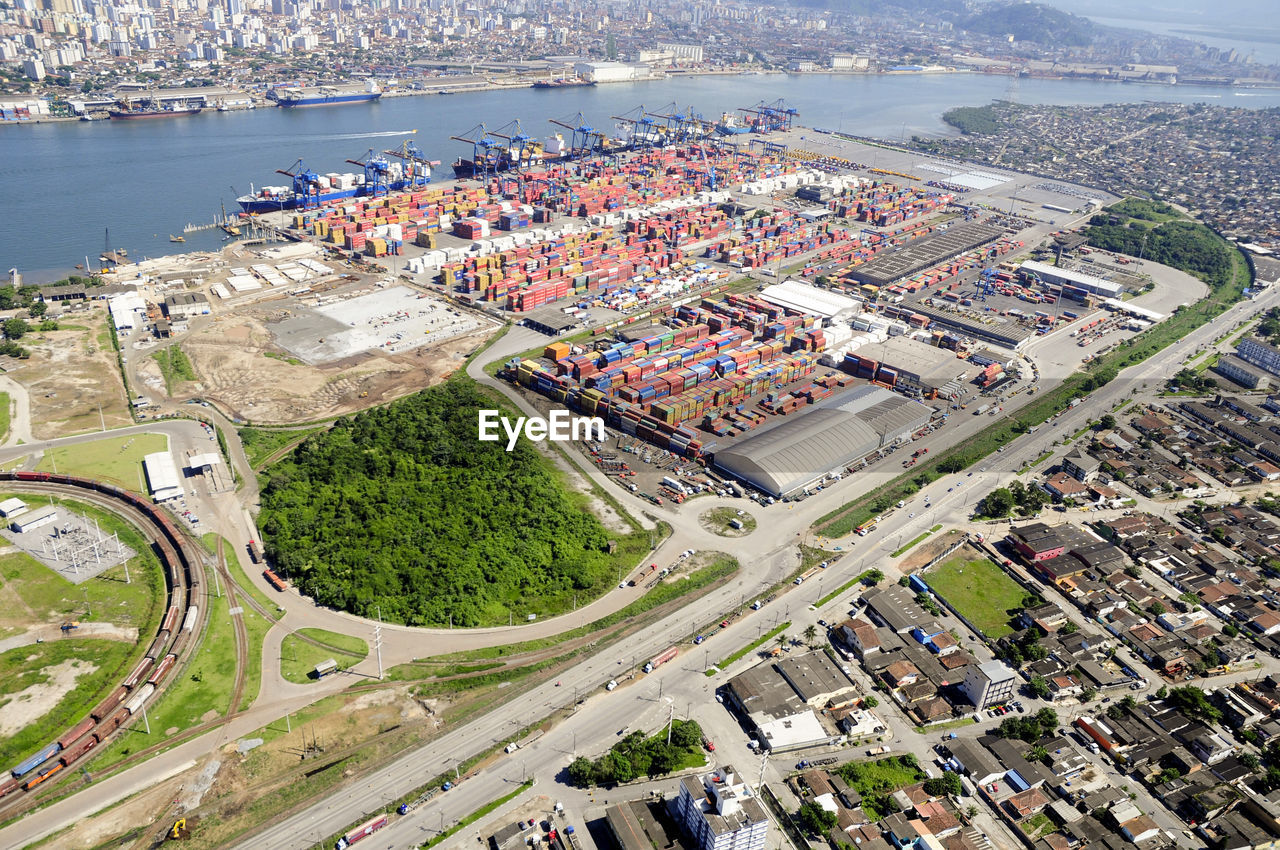 HIGH ANGLE VIEW OF CITYSCAPE AND SEA