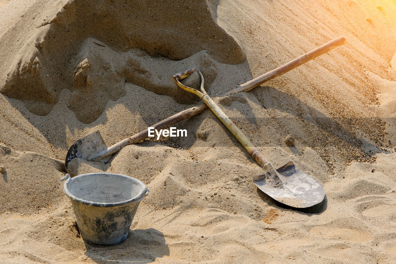 HIGH ANGLE VIEW OF METAL ON BEACH