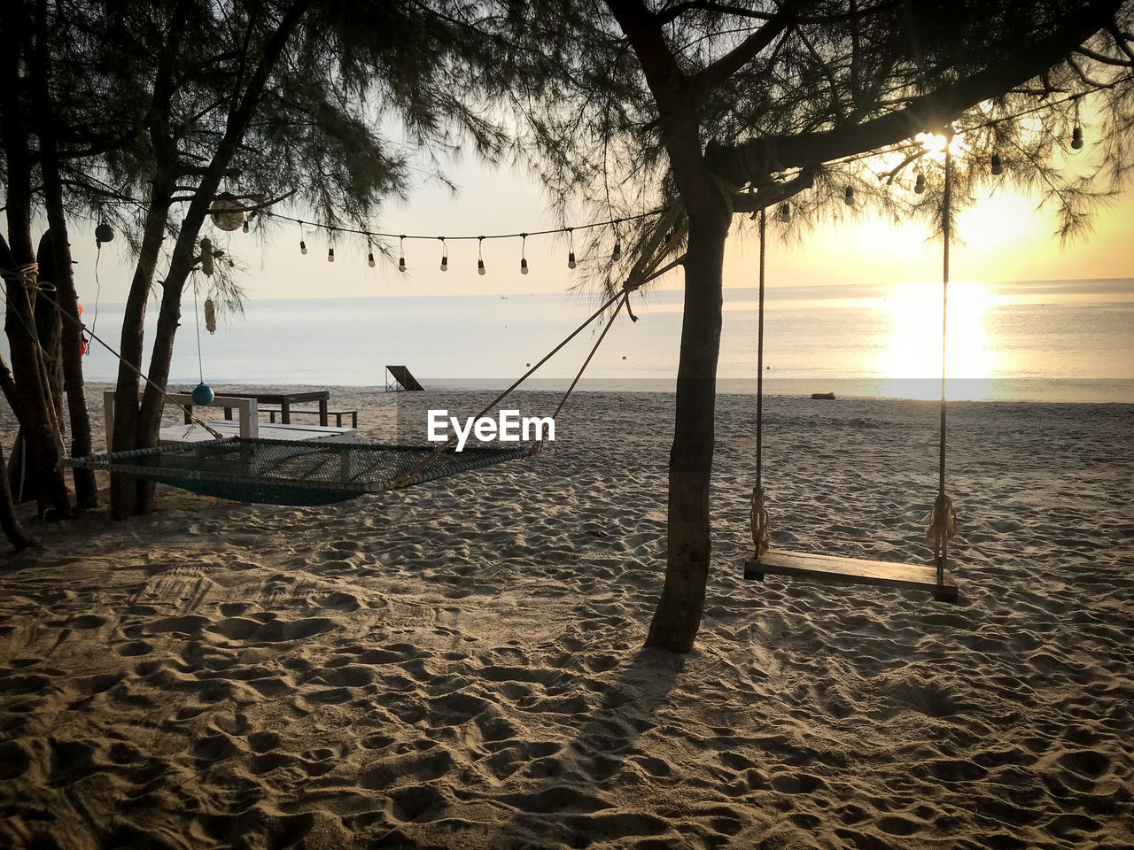 Scenic view of beach against sky during sunset