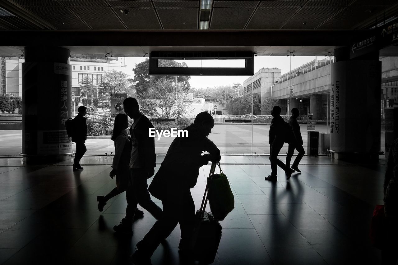 PEOPLE WAITING AT AIRPORT