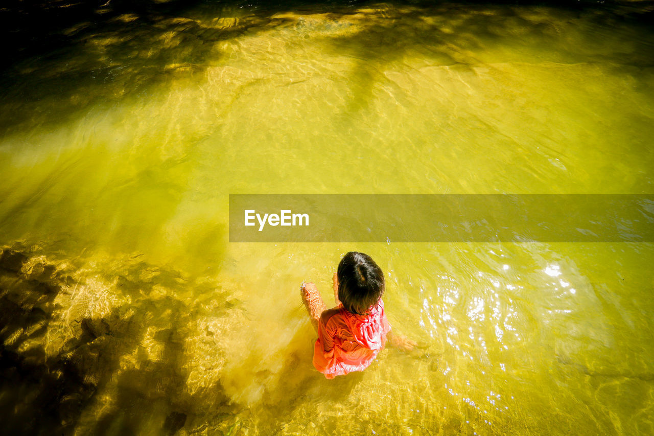 Children playing in the stream