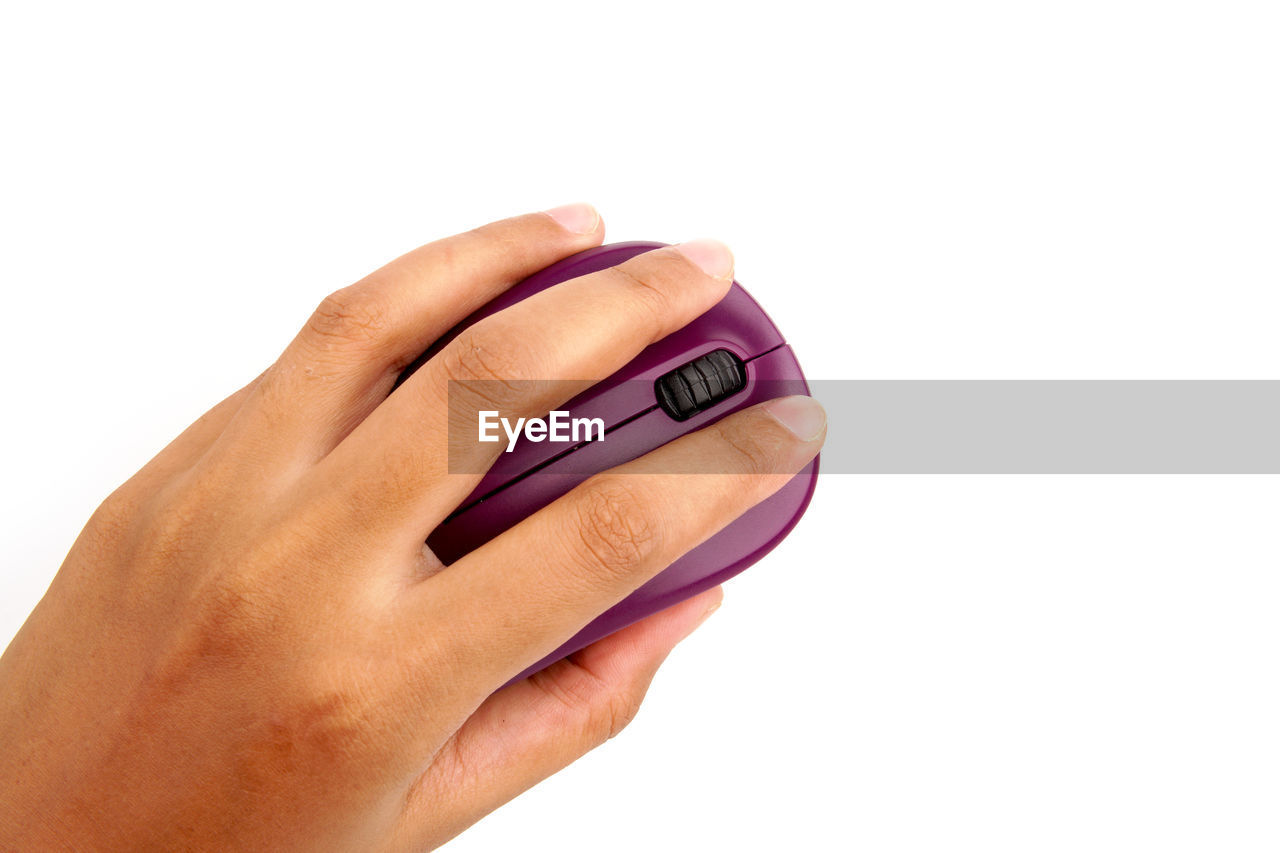 CLOSE-UP OF WOMAN HAND ON WHITE BACKGROUND