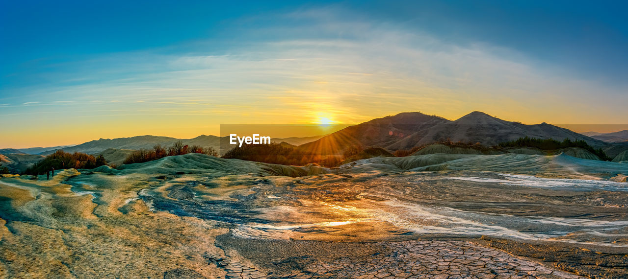 SCENIC VIEW OF MOUNTAINS DURING SUNSET