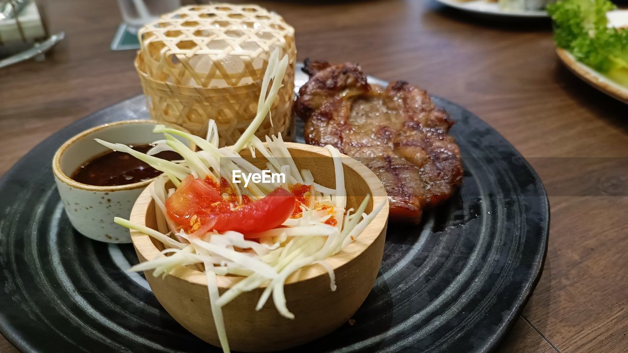 food and drink, food, freshness, healthy eating, dish, meal, plate, vegetable, table, indoors, no people, cuisine, wellbeing, fast food, meat, still life, high angle view, wood, serving size, asian food, close-up, bowl, lunch, focus on foreground, breakfast, salad