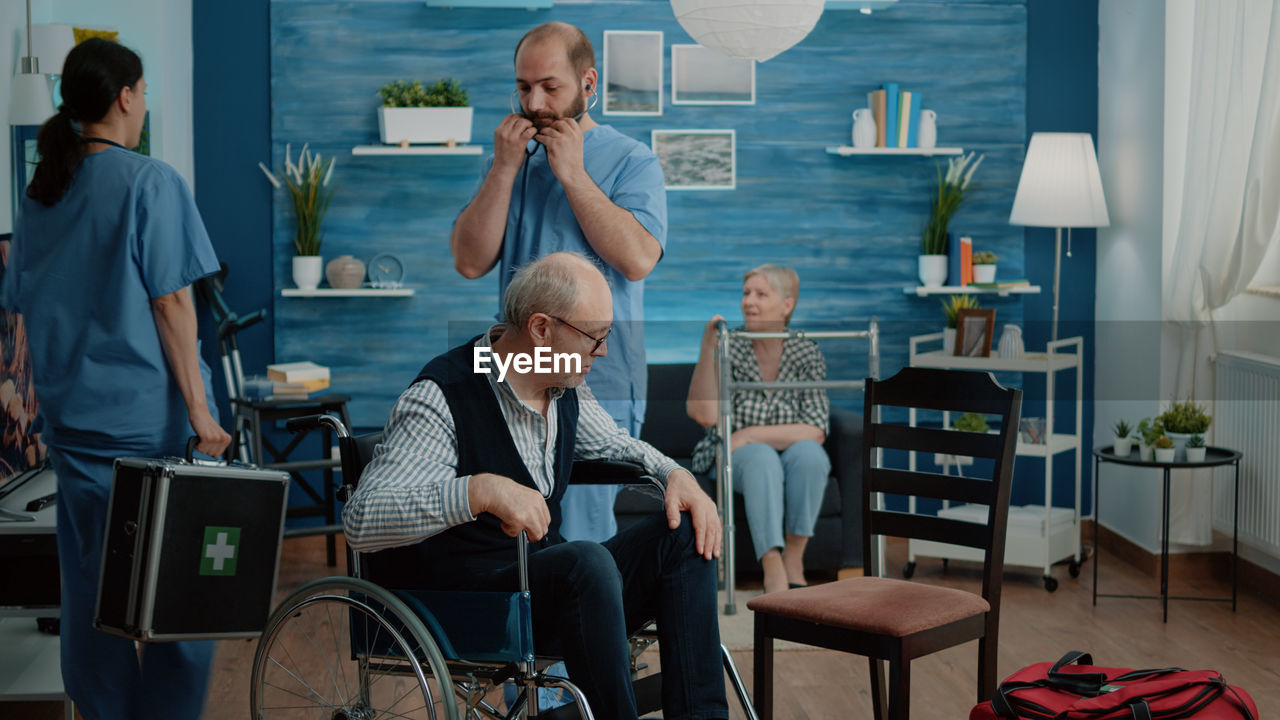 Patient and doctors in clinic