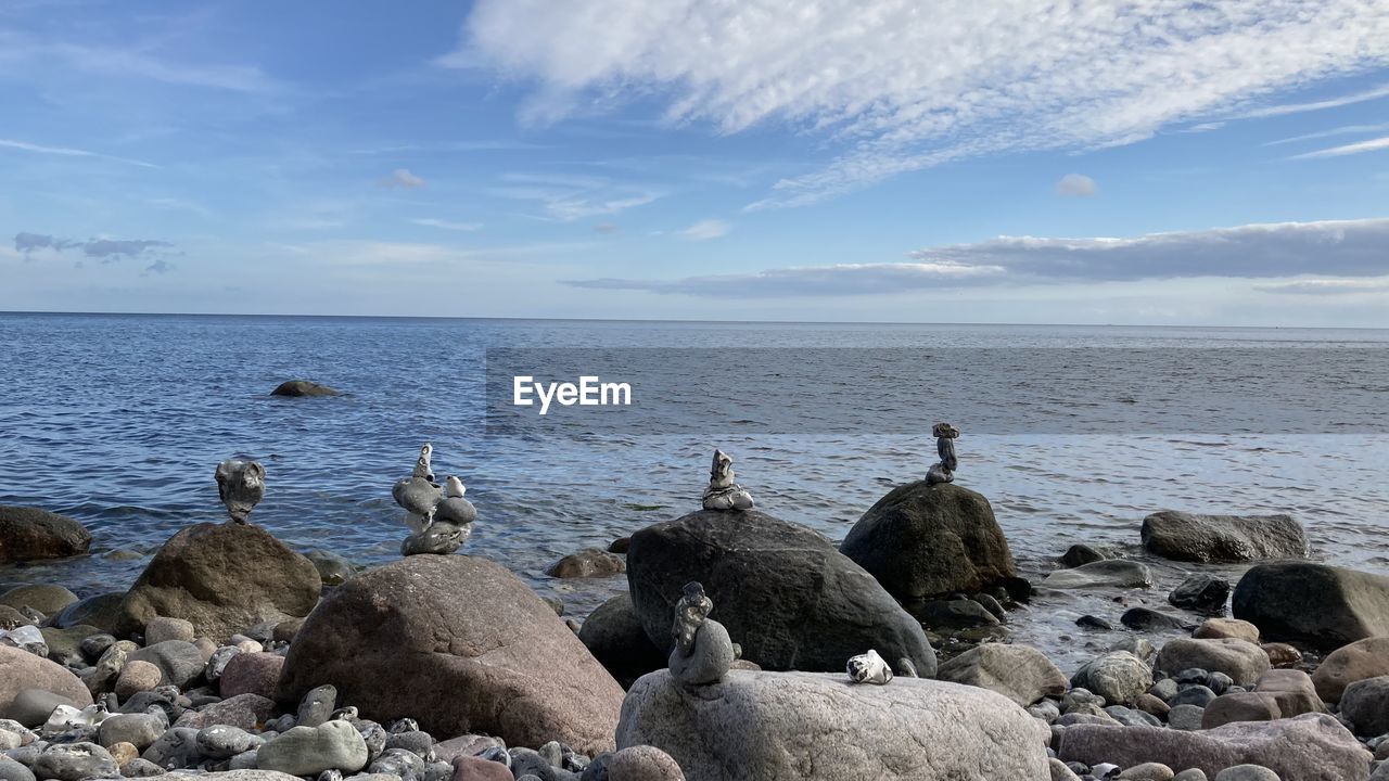 Scenic view of sea against sky at the baltic sea with stone stacks in the foreground 