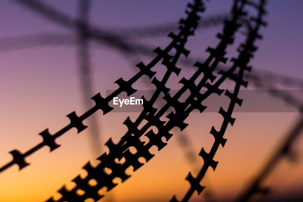 Low angle view of telephone pole against sky