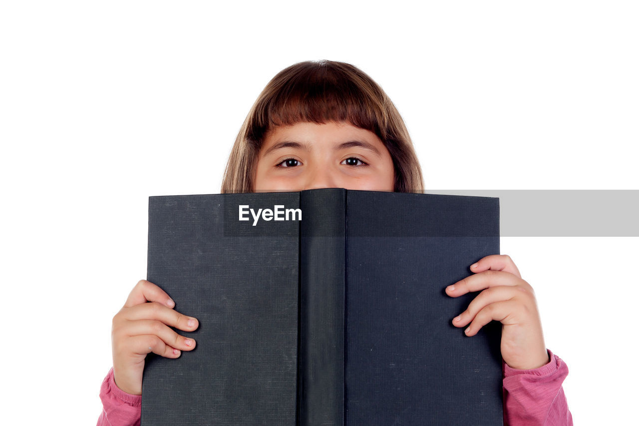 PORTRAIT OF A WOMAN WEARING BOOK