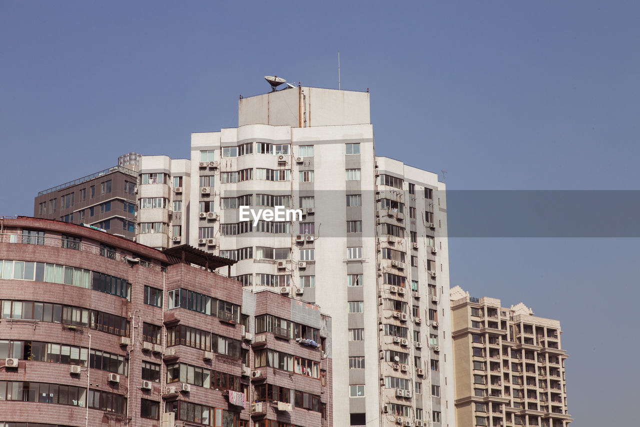 Low angle view of buildings against clear sky