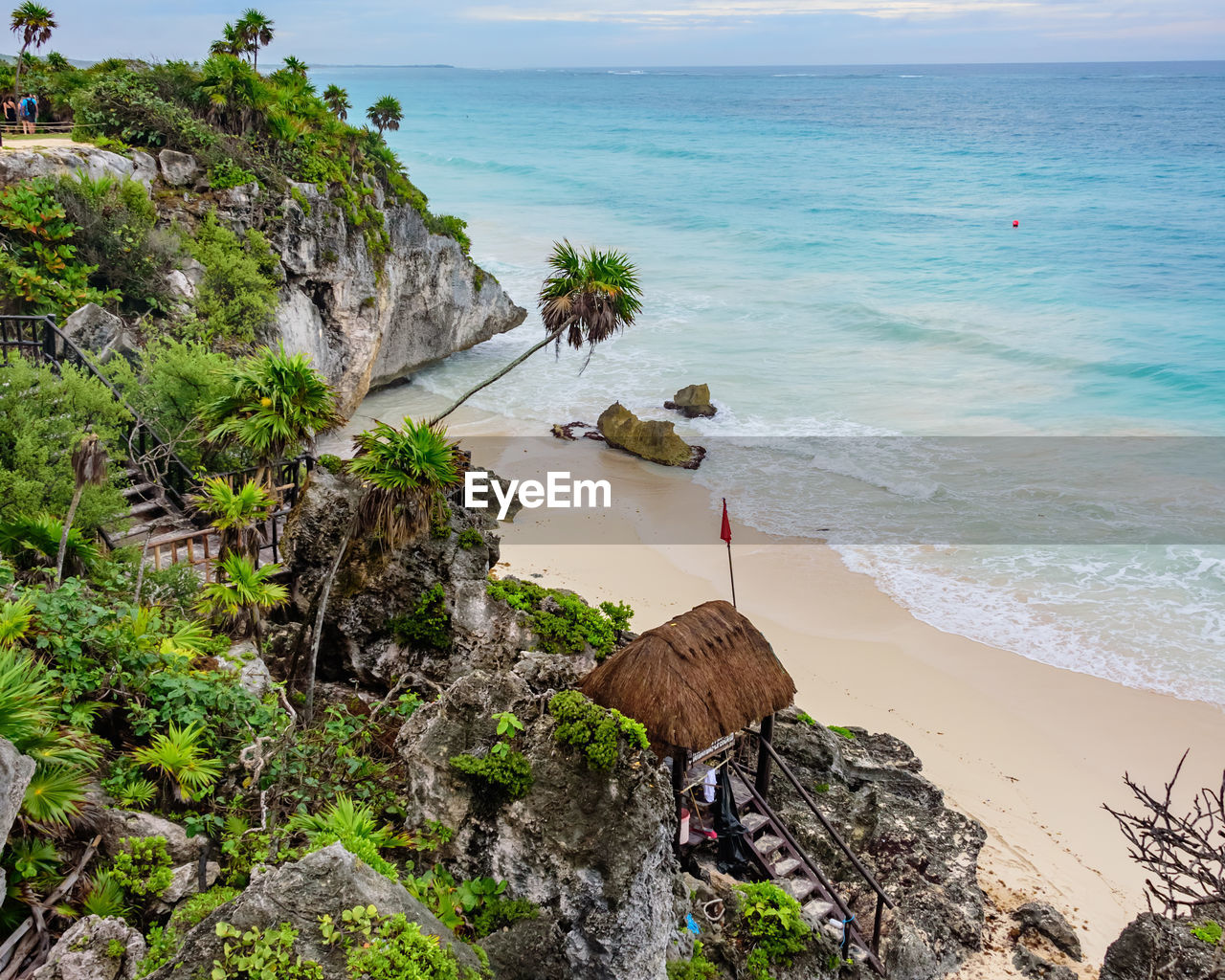 High angle view of rocks on beach against sky