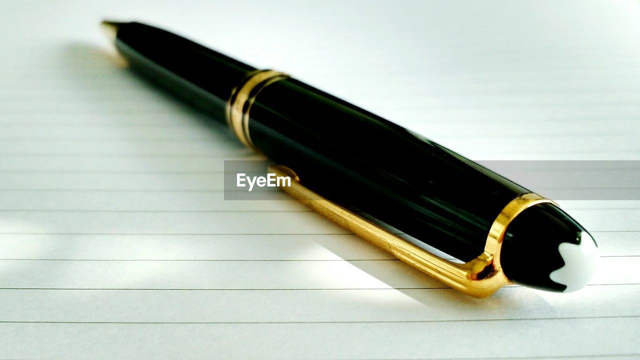 Close-up of luxury pen on paper