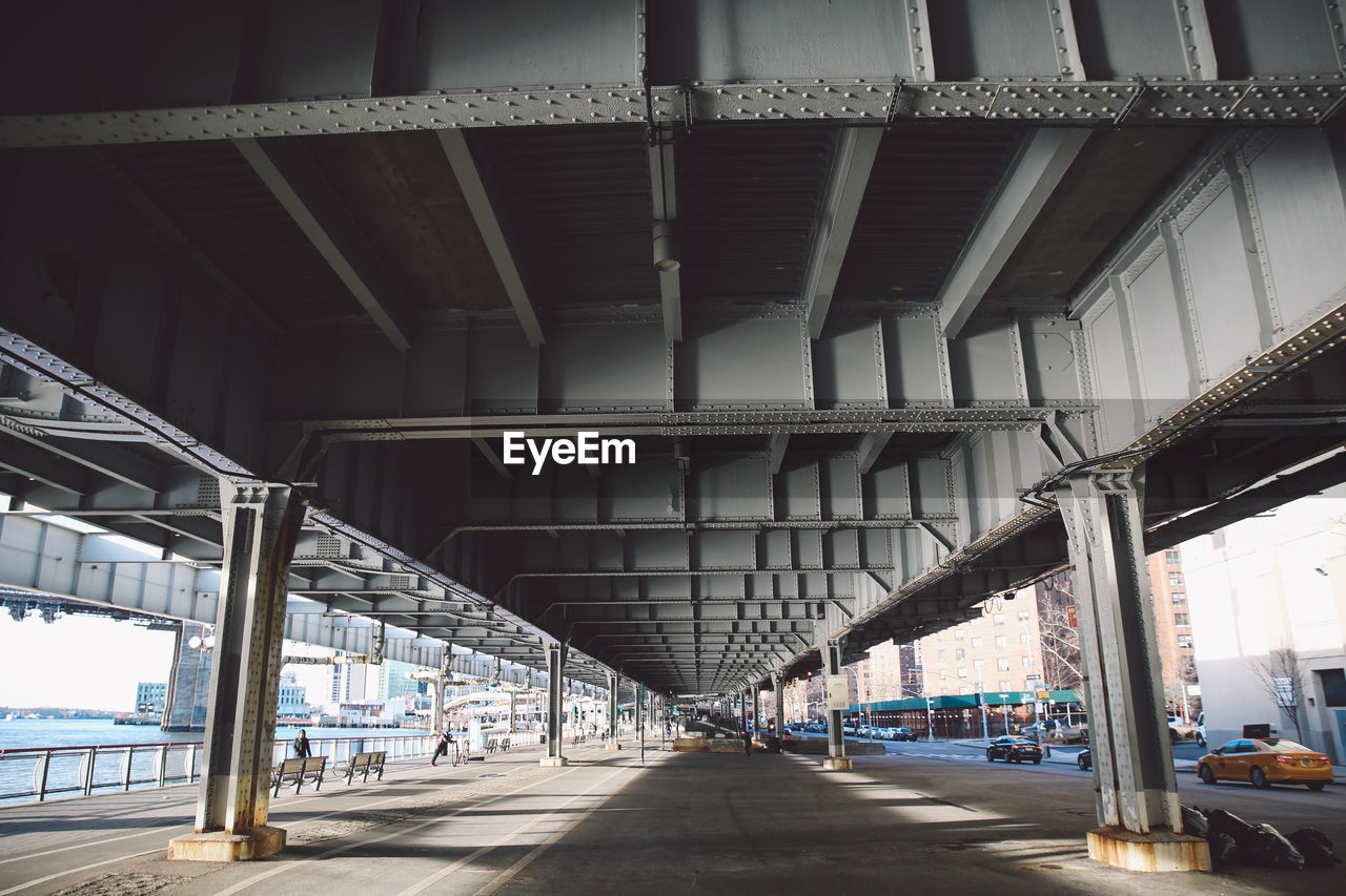 Walkway below elevated road in manhattan