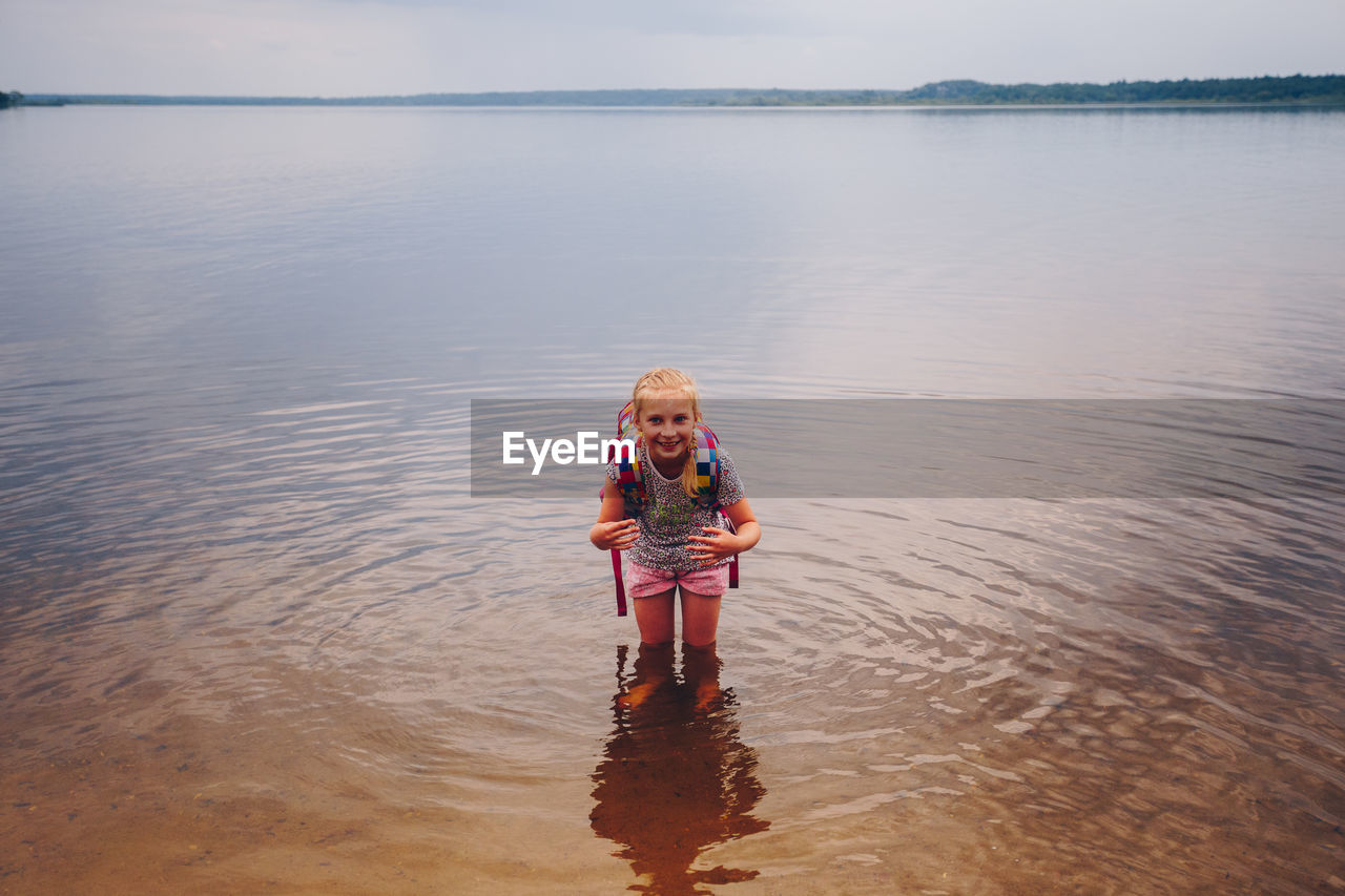 Portrait of girl bending in sea