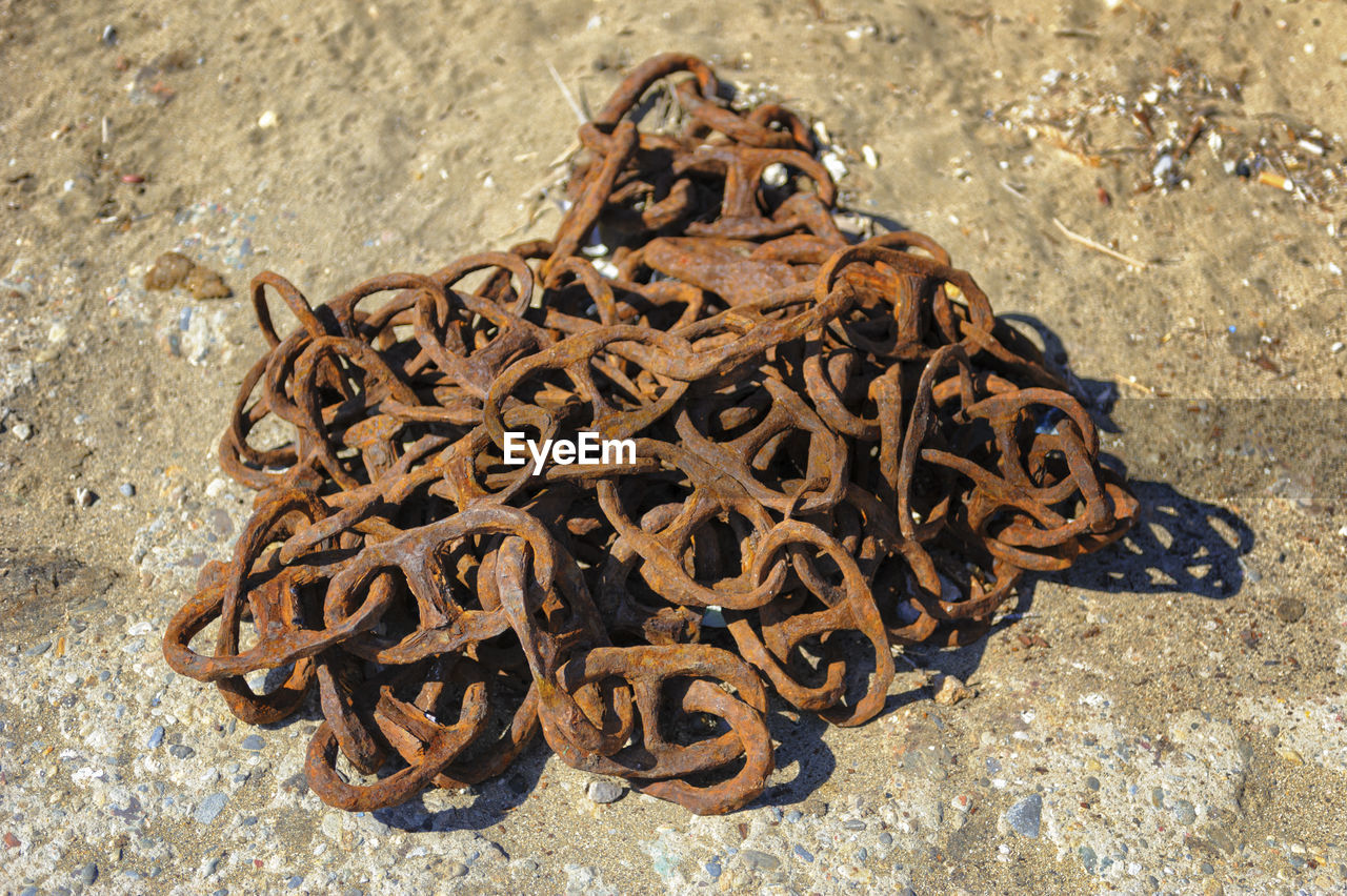 Close-up of a chain on the ground