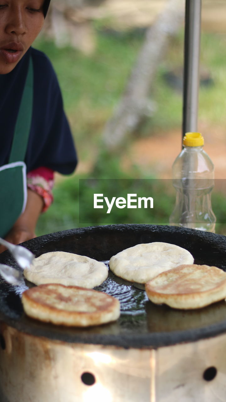 one person, adult, day, food and drink, men, nature, close-up, selective focus, outdoors, focus on foreground