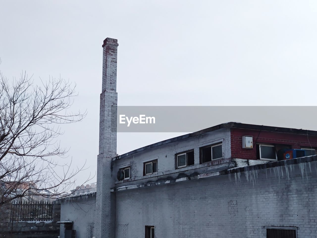 SMOKE STACK AGAINST SKY