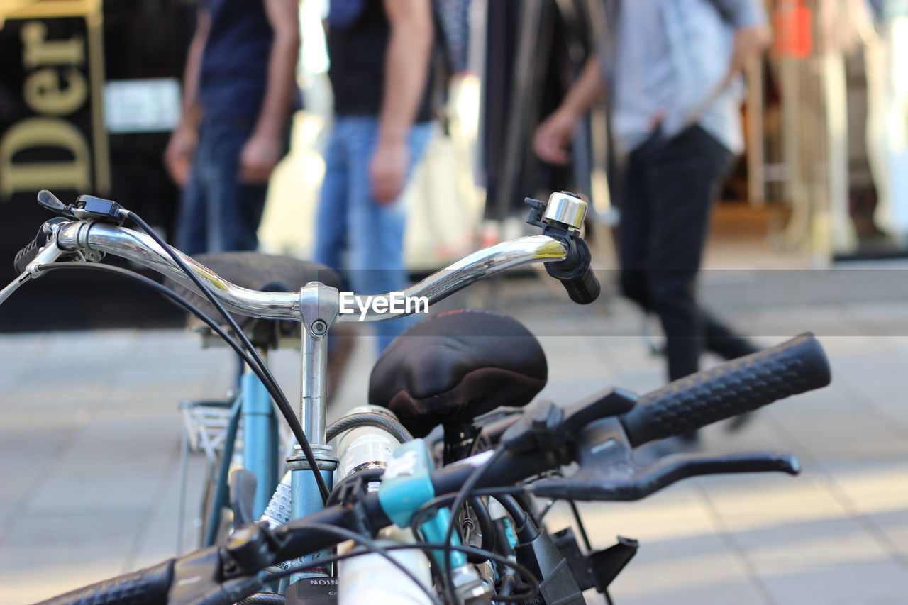 Close-up of bicycle on street