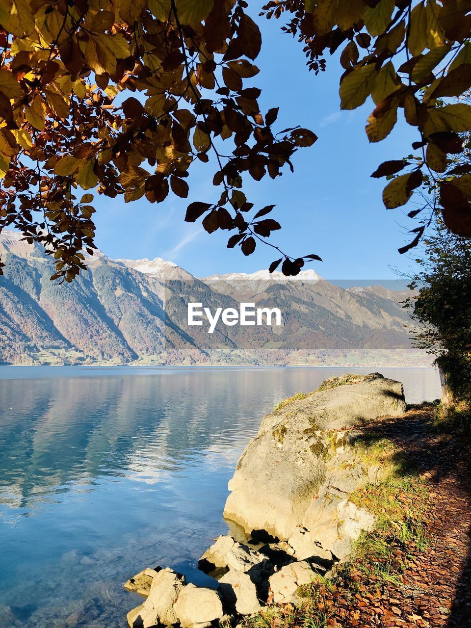 SCENIC VIEW OF LAKE AGAINST MOUNTAIN