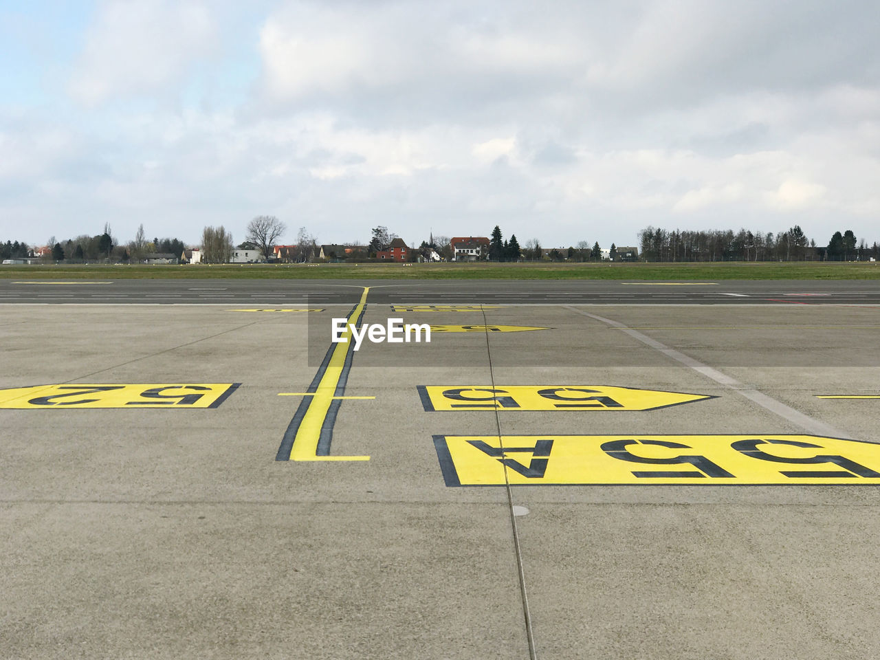 YELLOW TEXT ON AIRPORT RUNWAY