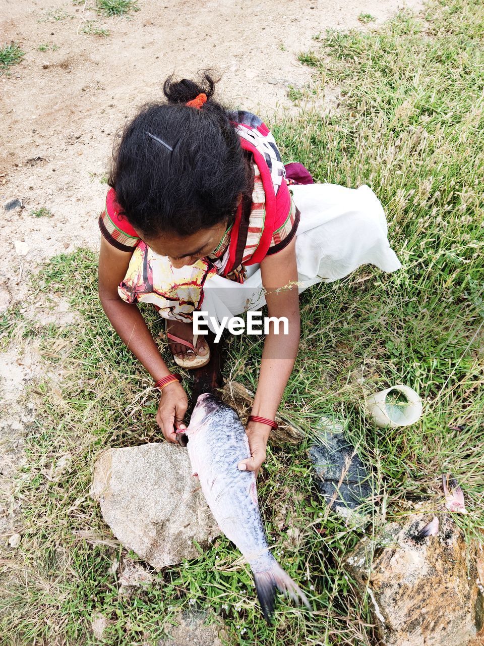 HIGH ANGLE VIEW OF GIRL ON FIELD DURING SUNNY DAY