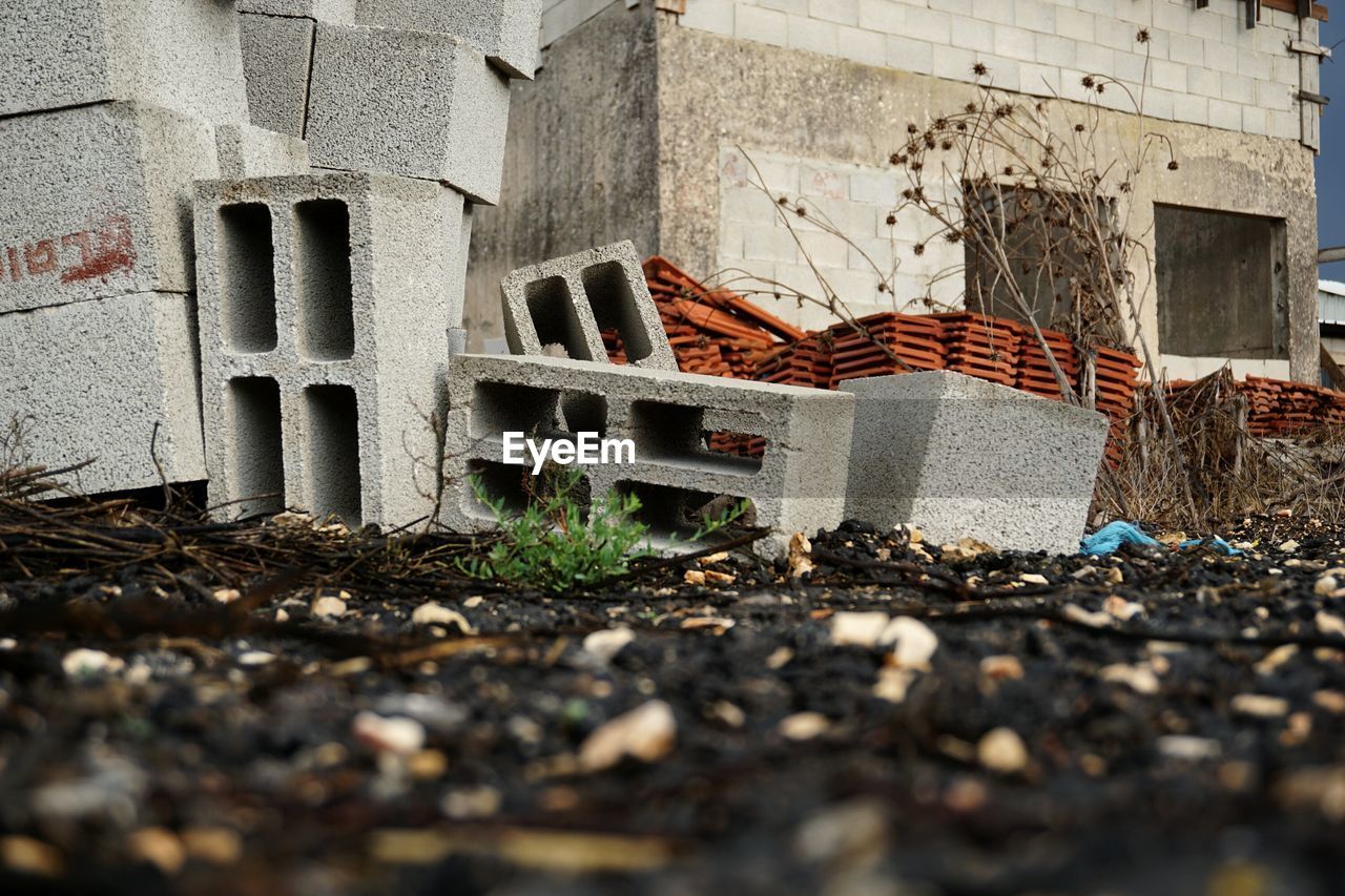 Concrete blocks on field against building