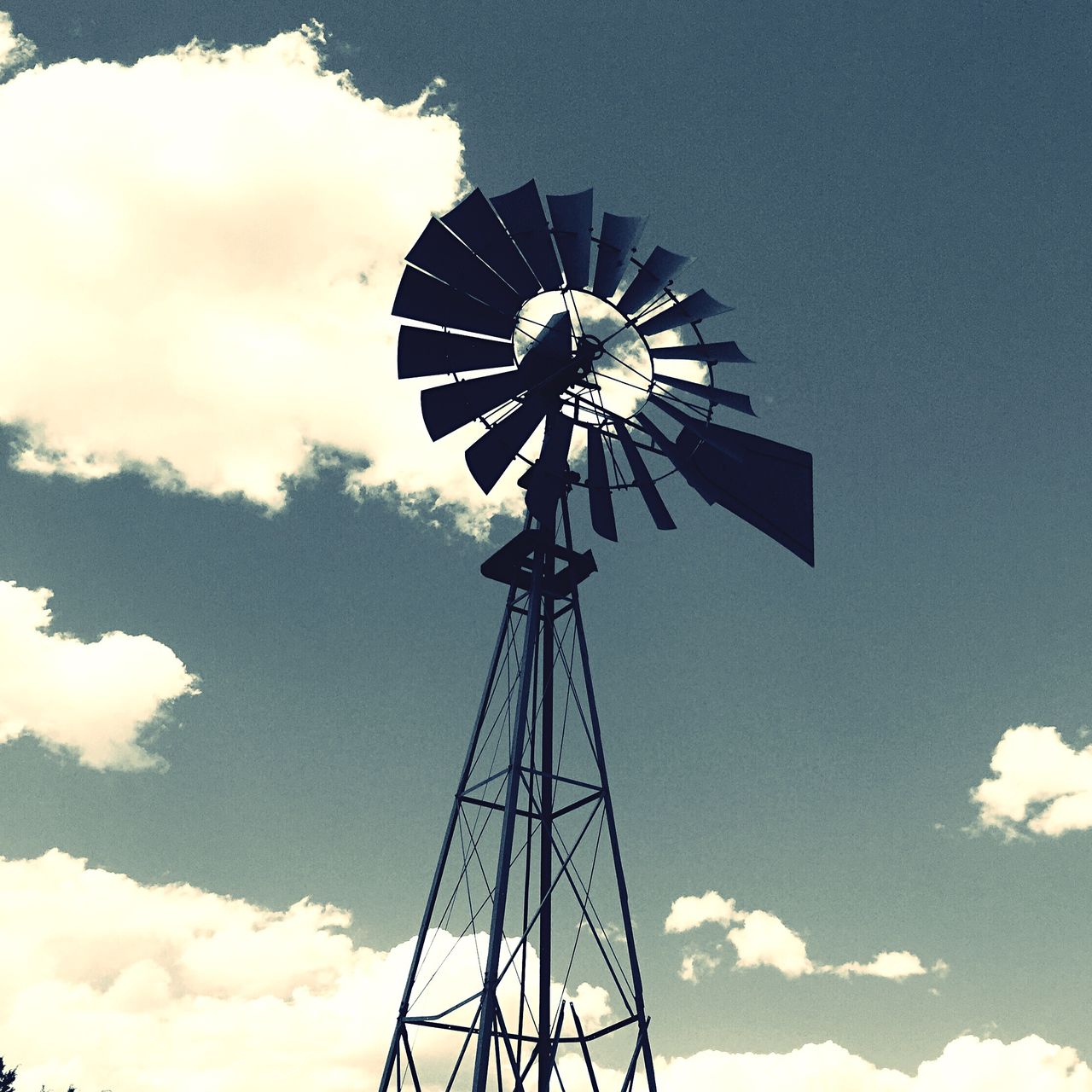 Low angle view of windmill against the sky