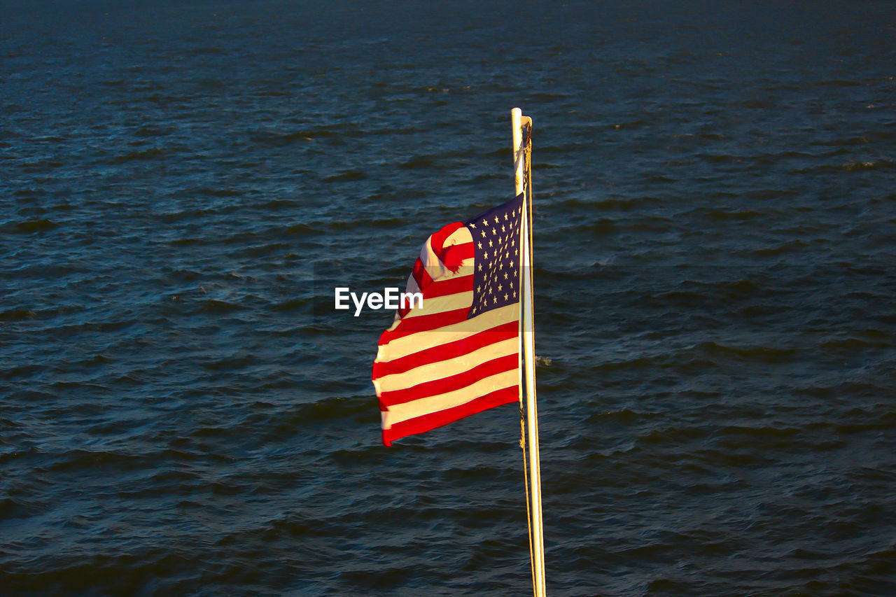 American flag against sea