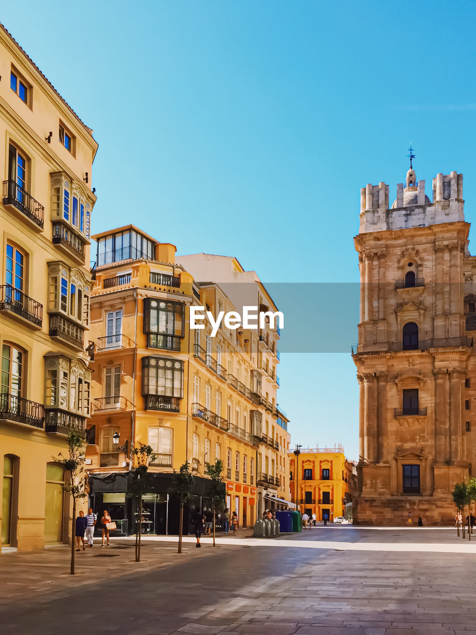 low angle view of buildings against clear blue sky